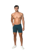 Teal stretch knit shorts with a sleek design and subtle stitching details in a form-fitting style