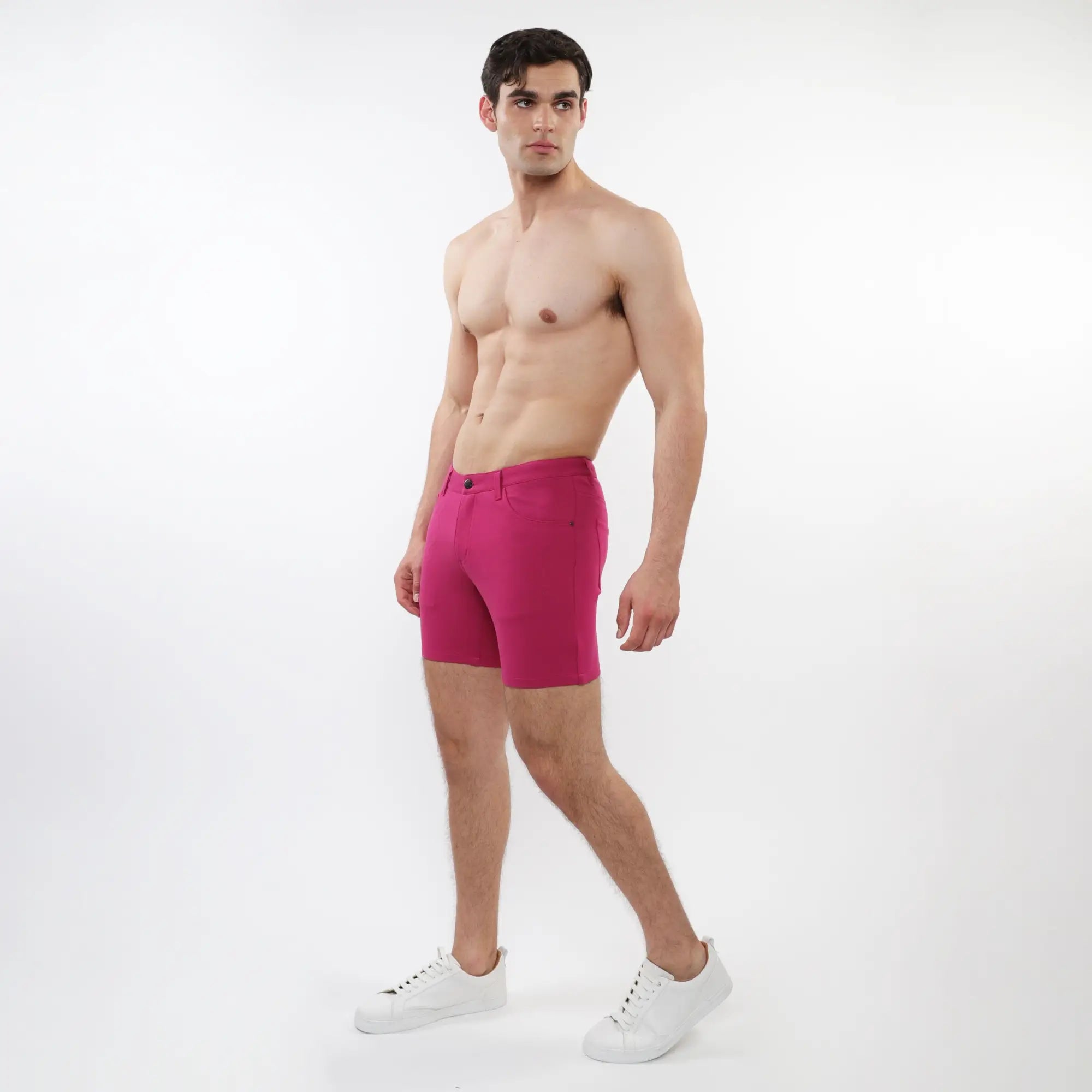 Vibrant fuchsia stretch knit short for men featuring sleek modern design and subtle stitching details