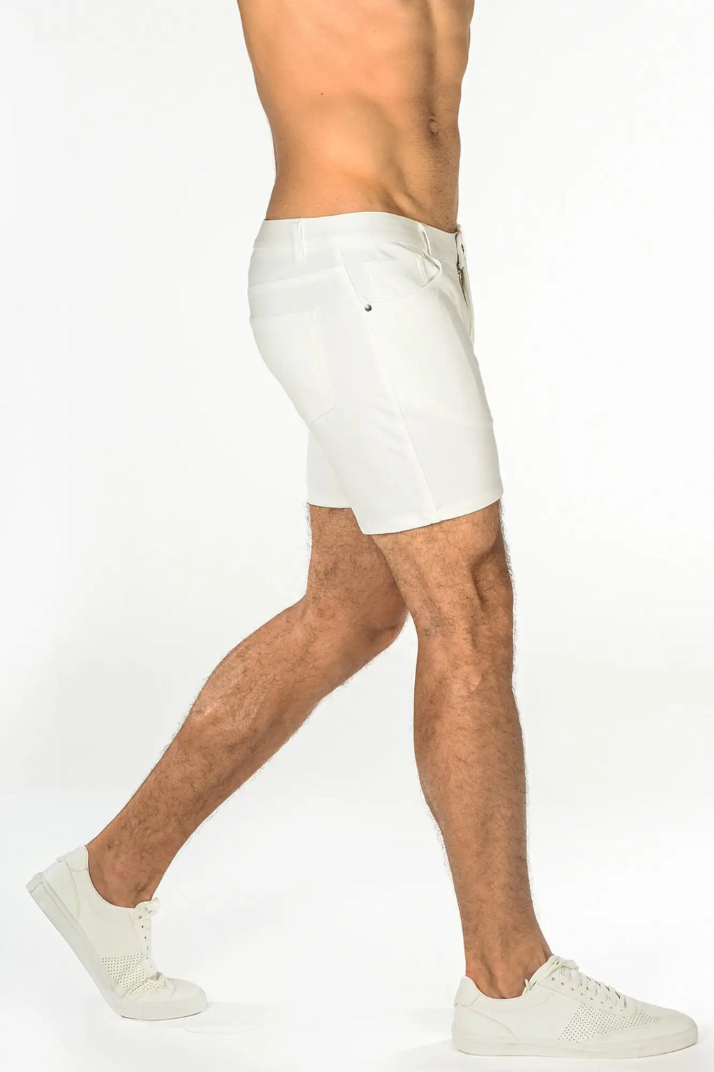 White stretch knit shorts with sleek modern design and subtle stitching details for athletic use