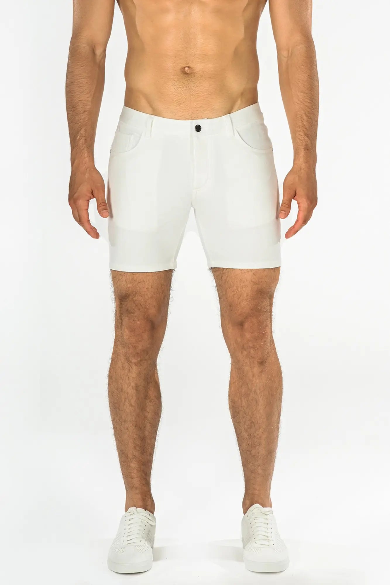 White stretch knit short with sleek modern design and subtle stitching details in athletic shorts style