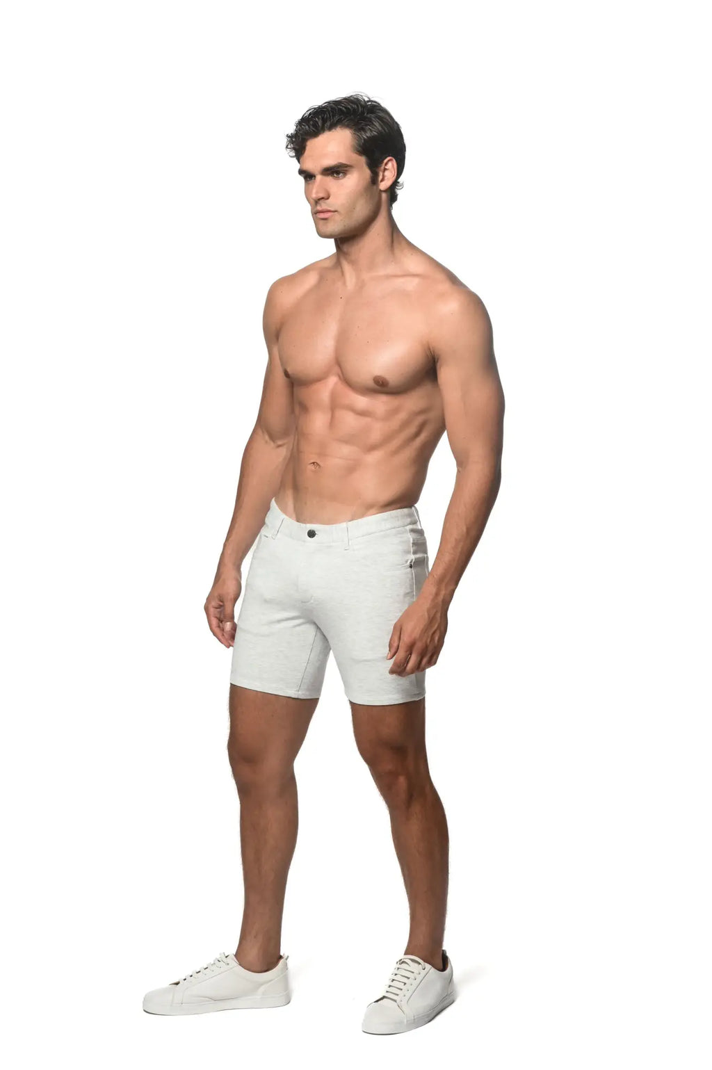 White stretch knit denim shorts with classic five-pocket design and button closure for casual wear