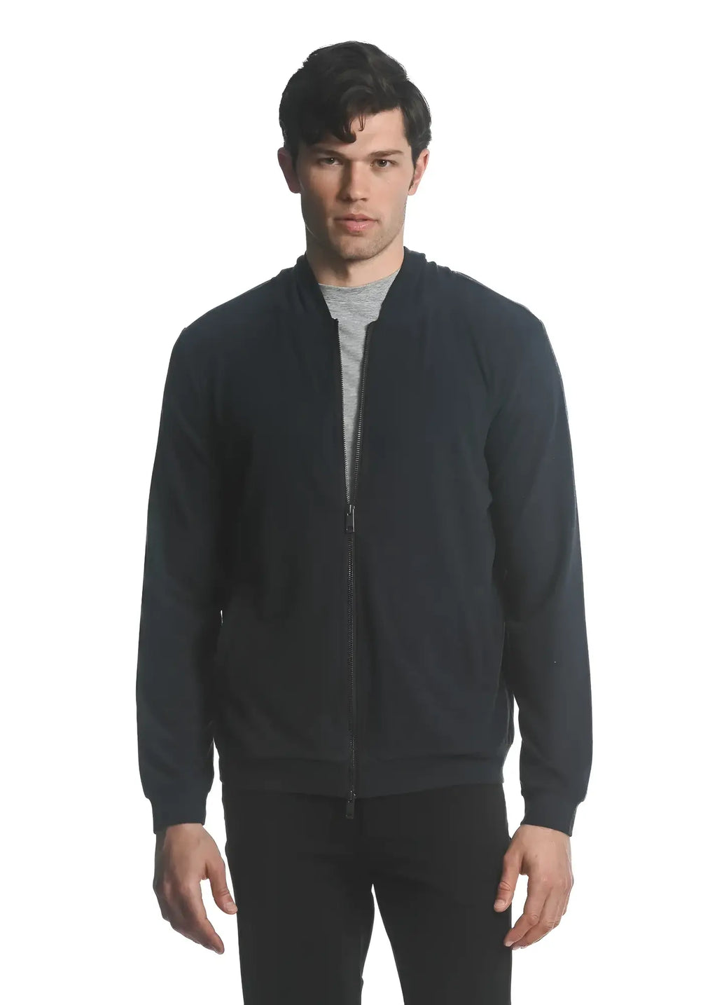 Black stretch knit zip-up hoodie with smooth textured fabric and ribbed cuffs for comfortable layering