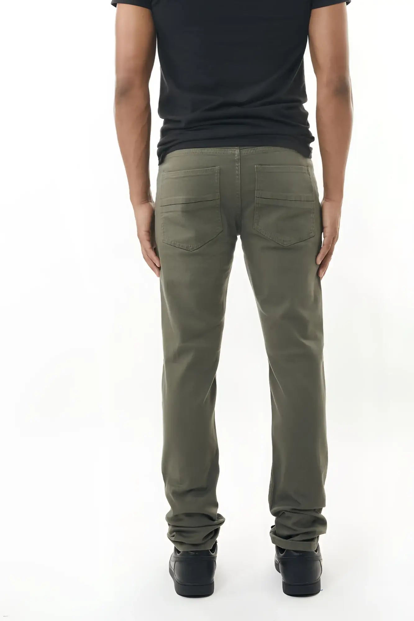 Olive green stretch twill pant straight-leg denim jeans with rear pockets and rolled cuffs shown from the back side