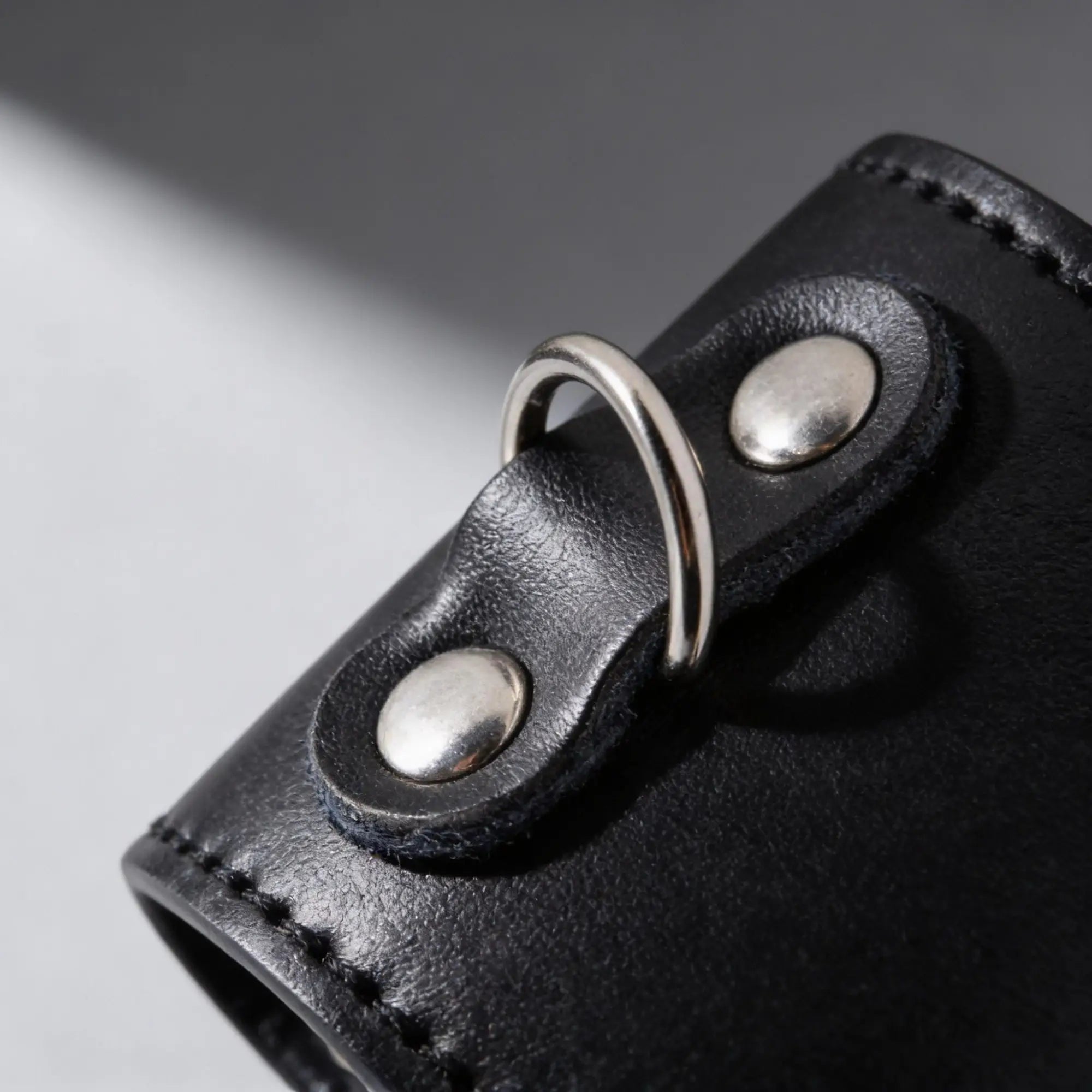 Strict 2 Inch Ball Stretcher in black leather with a silver D-ring attached by two silver rivets.
