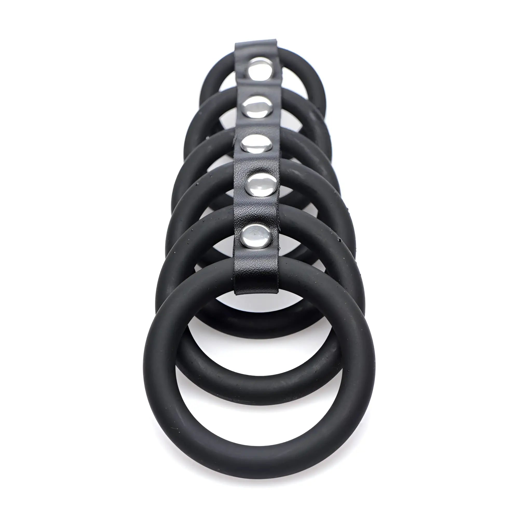 Strict 6 Ring Silicone Chastity Cage: Six black silicone rings aligned and connected by a central silver-studded strap.