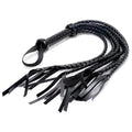 Strict 8 Tail Braided Flogger: A black leather flogger with a woven handle, wrist loop, and eight braided tails.