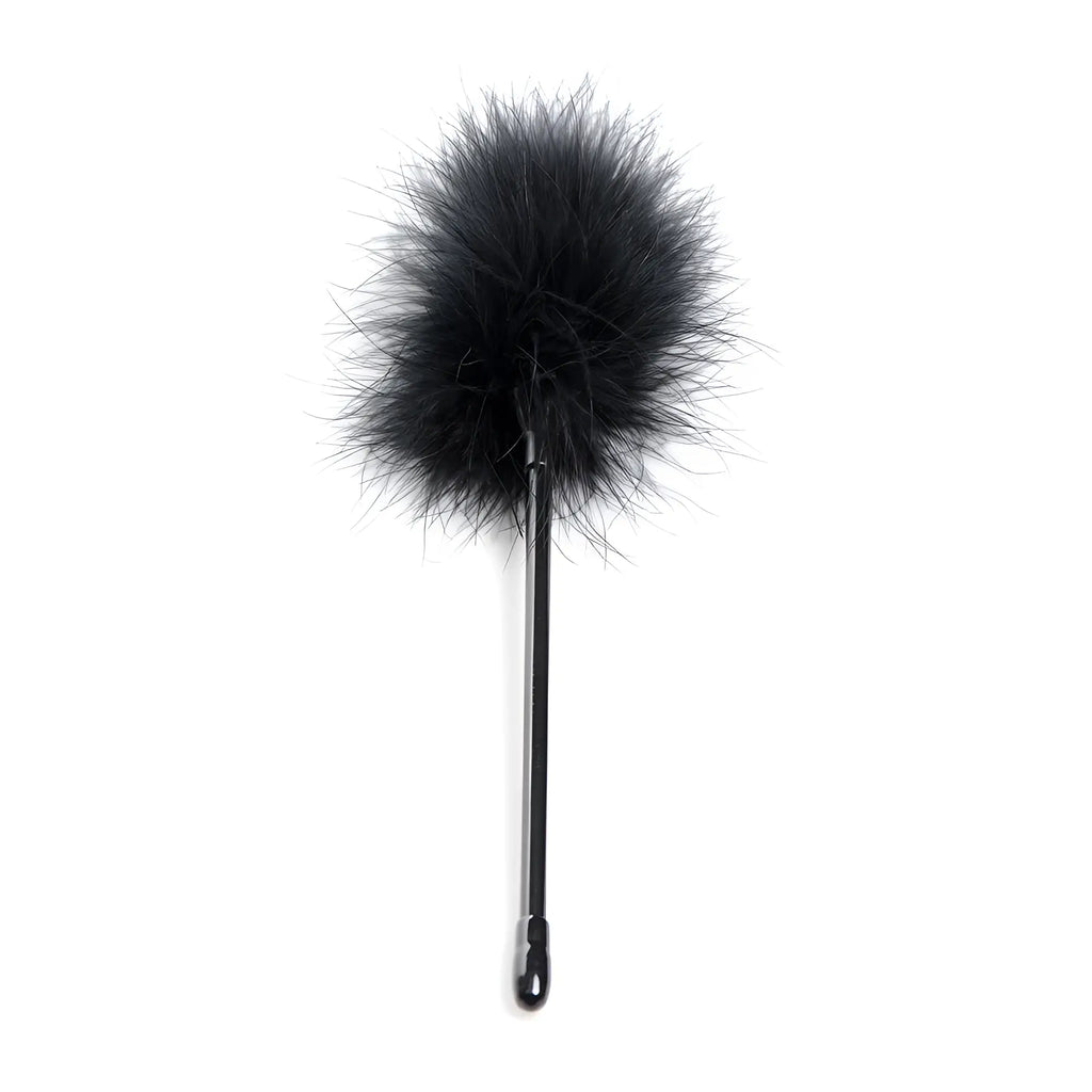 Strict Bed Restraint Bondage Kit: A black feather tickler with a sleek handle isolated on a white background.
