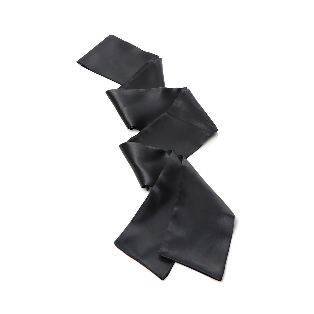Strict Bed Restraint Bondage Kit: A single, long, smooth black satin fabric strap coiled on a white background.