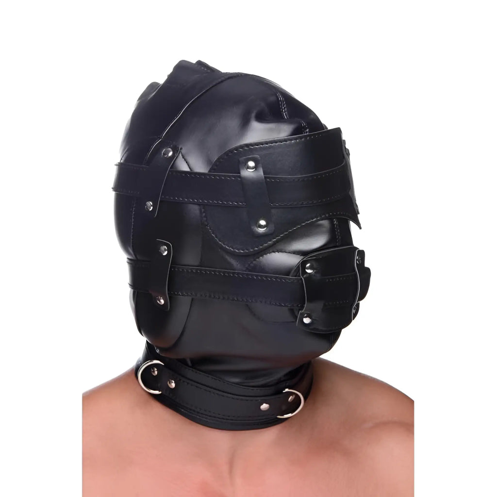 Strict Bondage Hood in black faux leather, featuring adjustable straps, eye coverings, a penis gag, and neck collar.