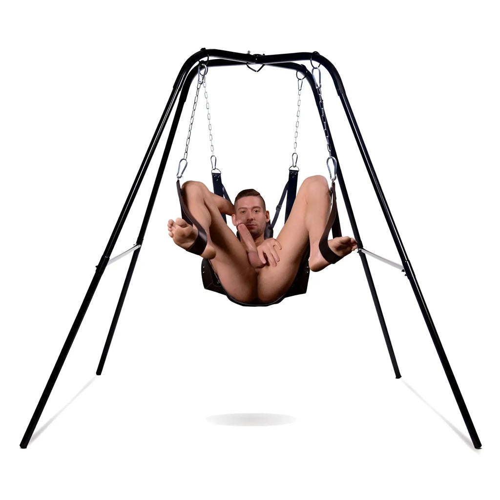 Strict Extreme Sling and Swing Stand: A black metal frame holding a black leather swing with a man positioned inside.