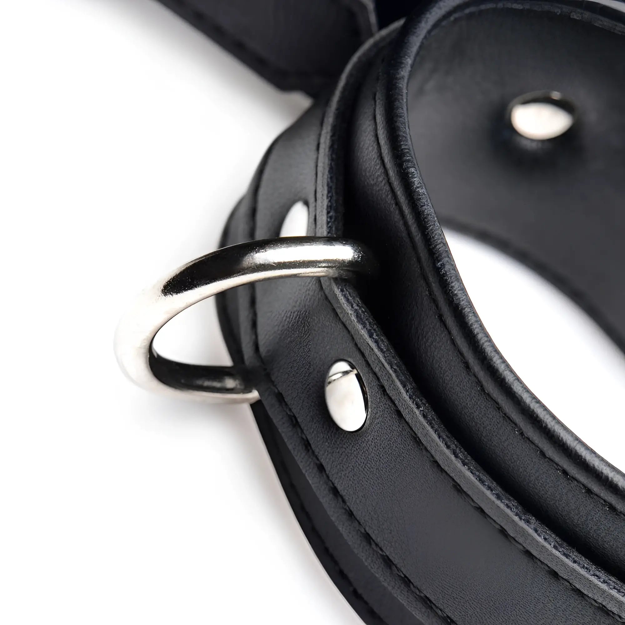 Strict Frog Tie Restraint Set in black faux leather with silver metal D-rings and rivets, isolated on white.