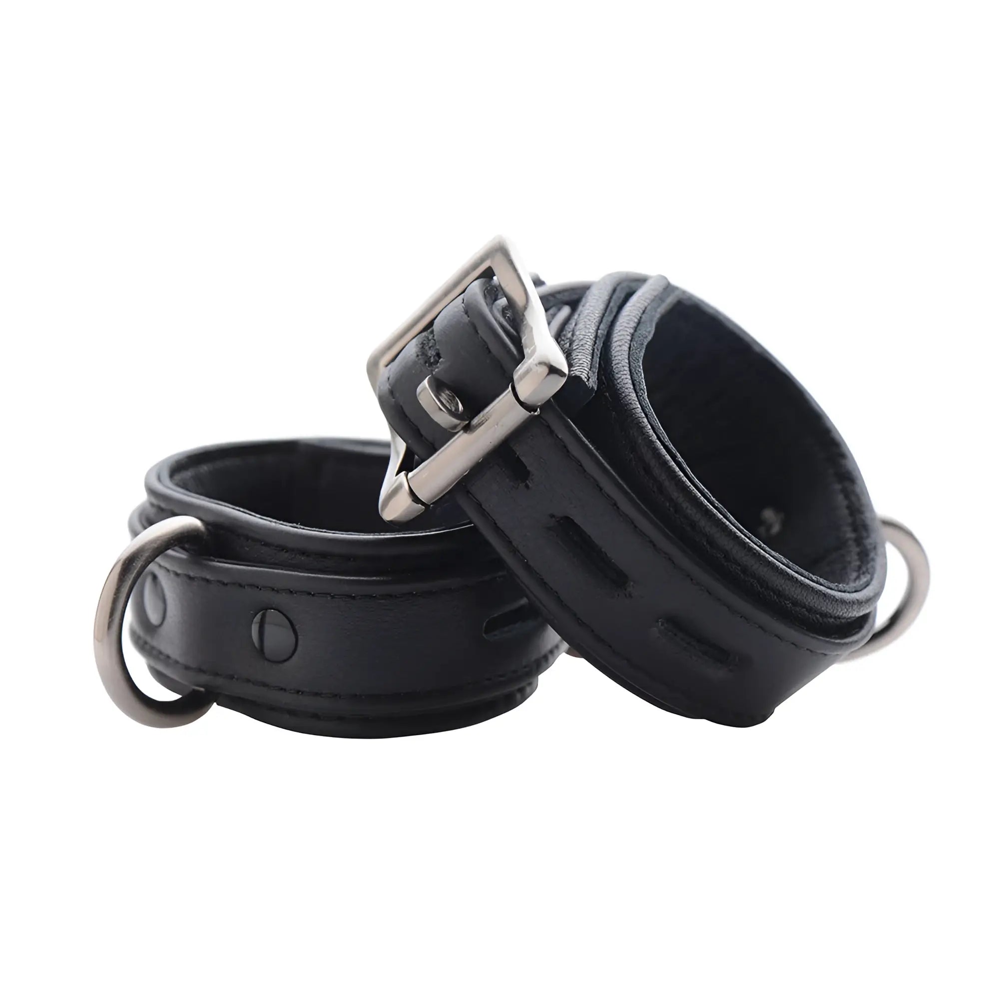 Strict Leather black premium leather cuffs with silver-toned buckles and D-rings, shown on a white background.