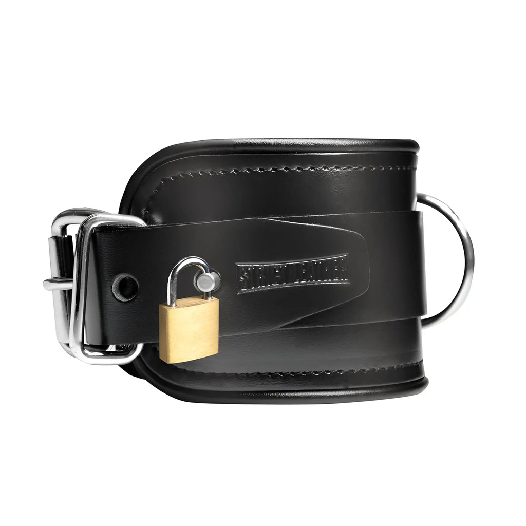 Strict Leather black leather wrist cuff with a metal buckle, D-ring, and gold-tone padlock.