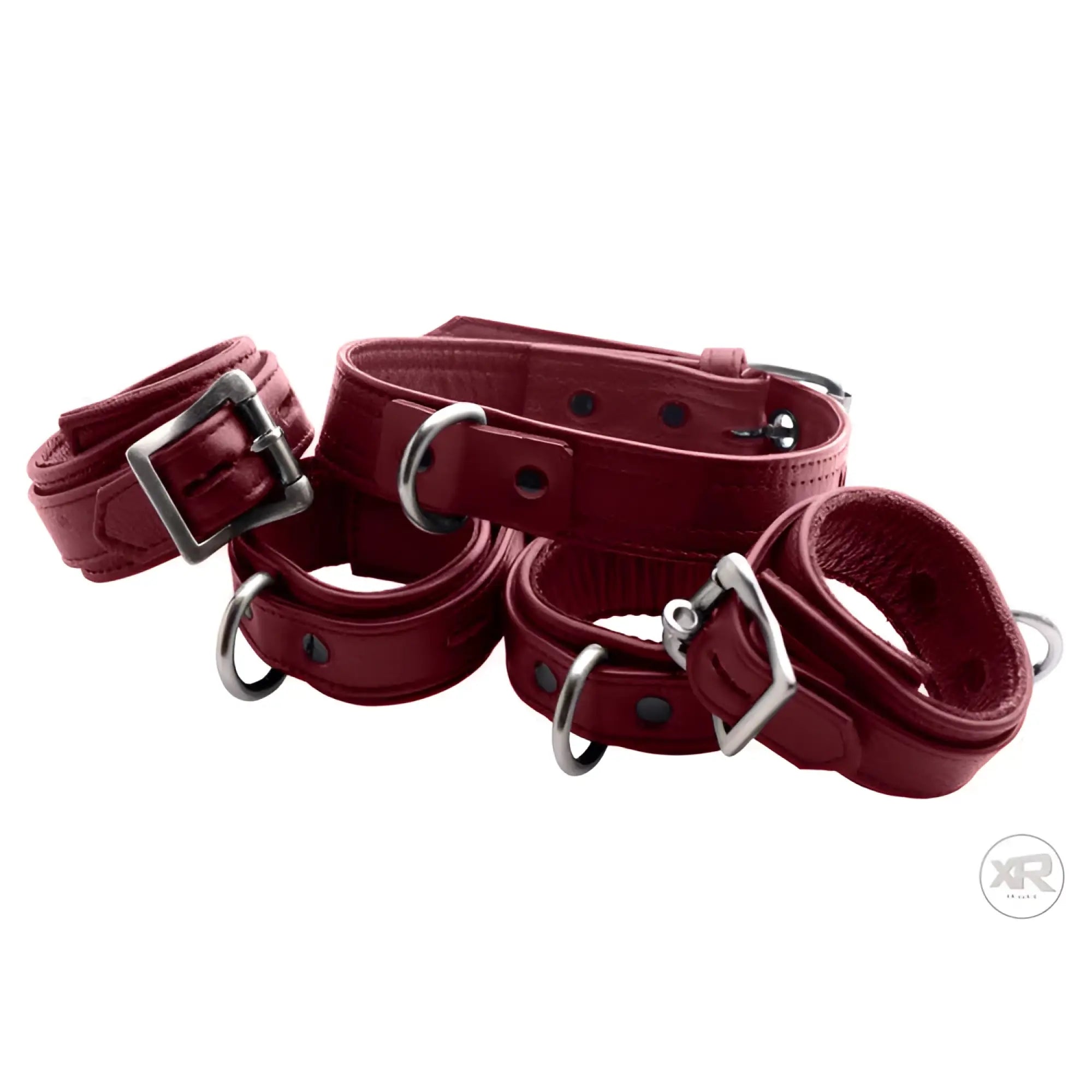 Strict Leather burgundy premium leather collar and cuff set with silver buckles and D-rings, isolated on white.