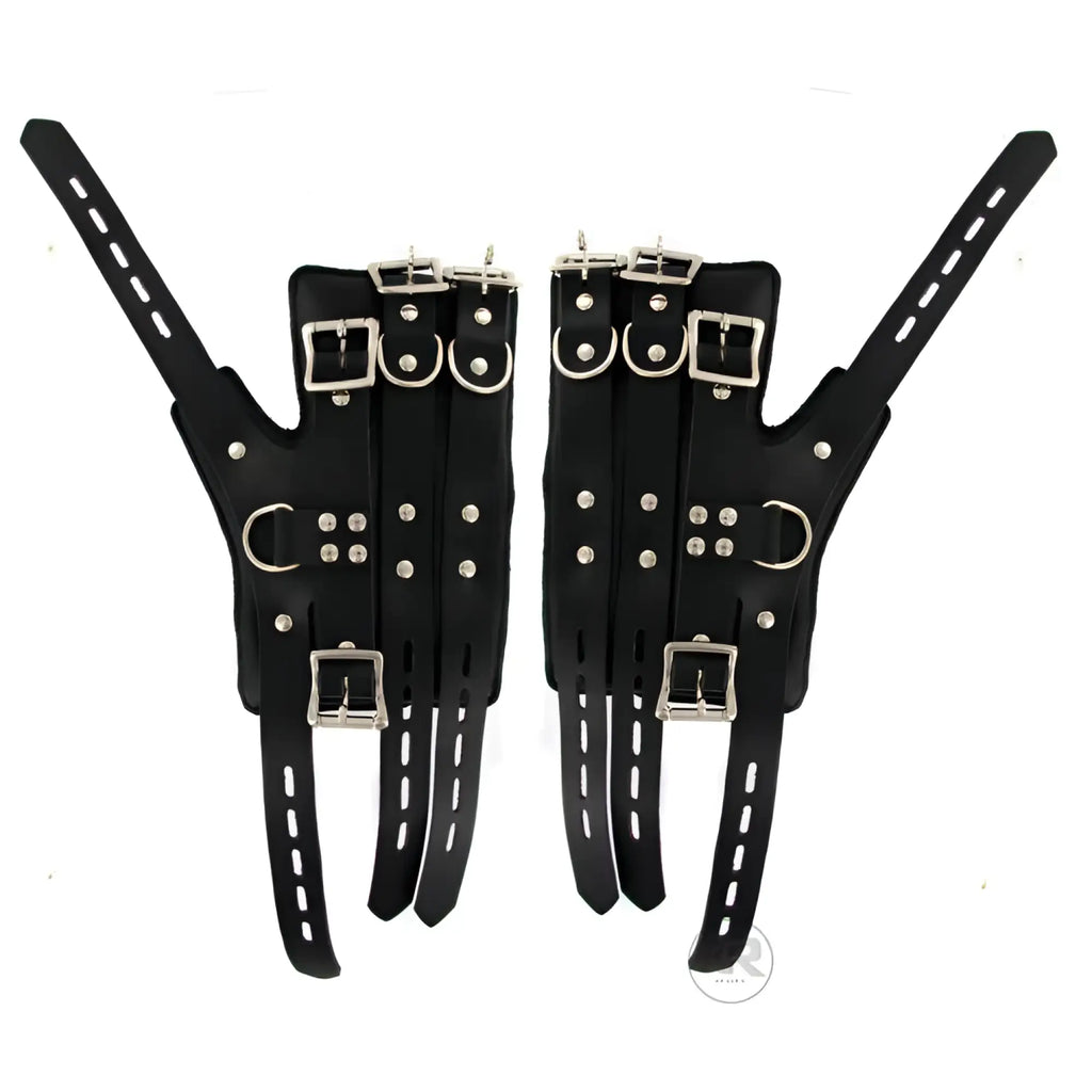 Strict Leather Four-Buckle Suspension Cuffs: A pair of black leather cuffs with silver buckles, straps, and hardware.