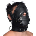Strict Leather head harness in black leather, featuring an eye mask, adjustable straps, and a removable mouth gag.