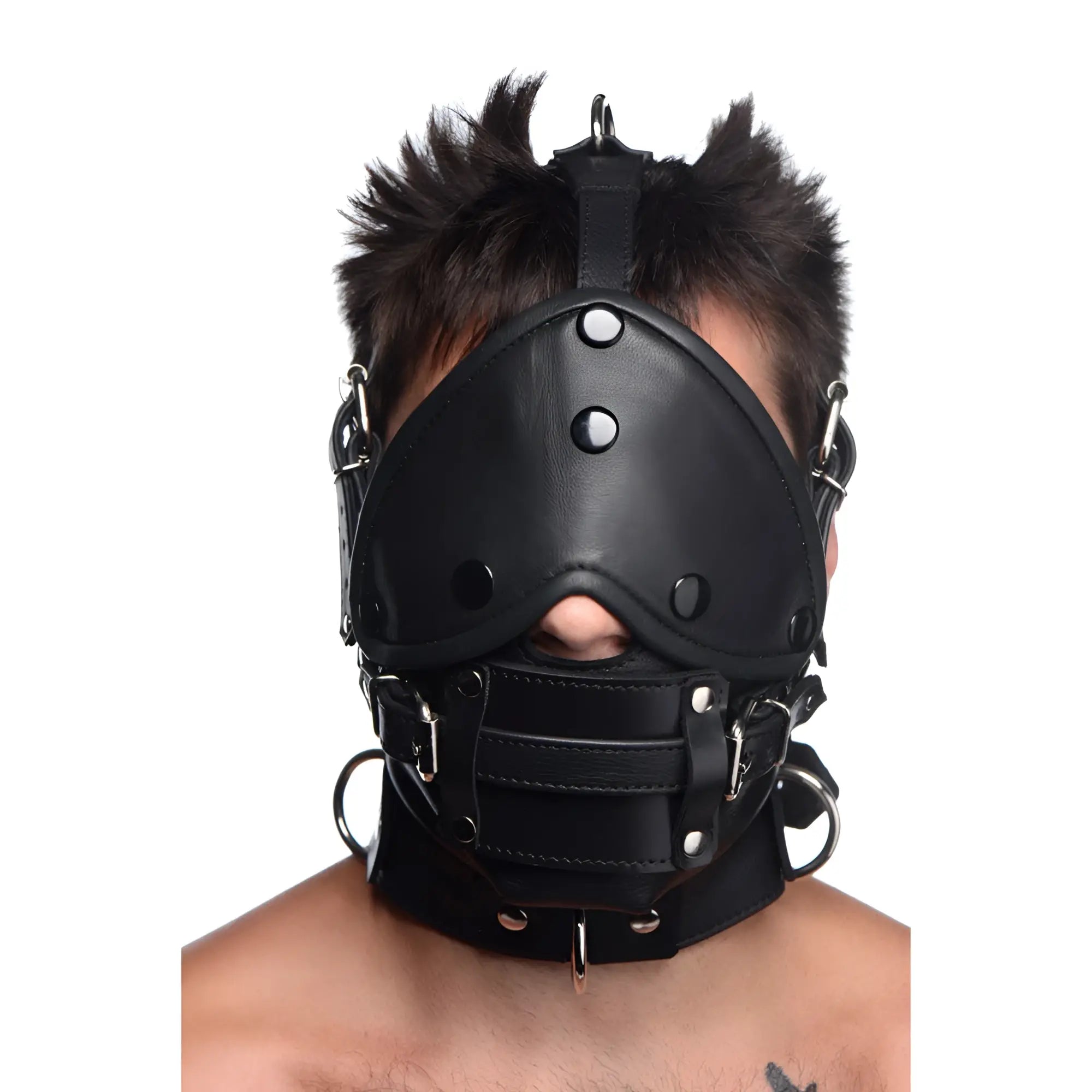 Strict Leather black leather head harness with silver hardware, eye mask, and removable mouth gag on a person.