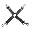 Strict Leather Hog Tie: X-shaped black leather straps joined by a central ring with four silver swivel snap hooks.