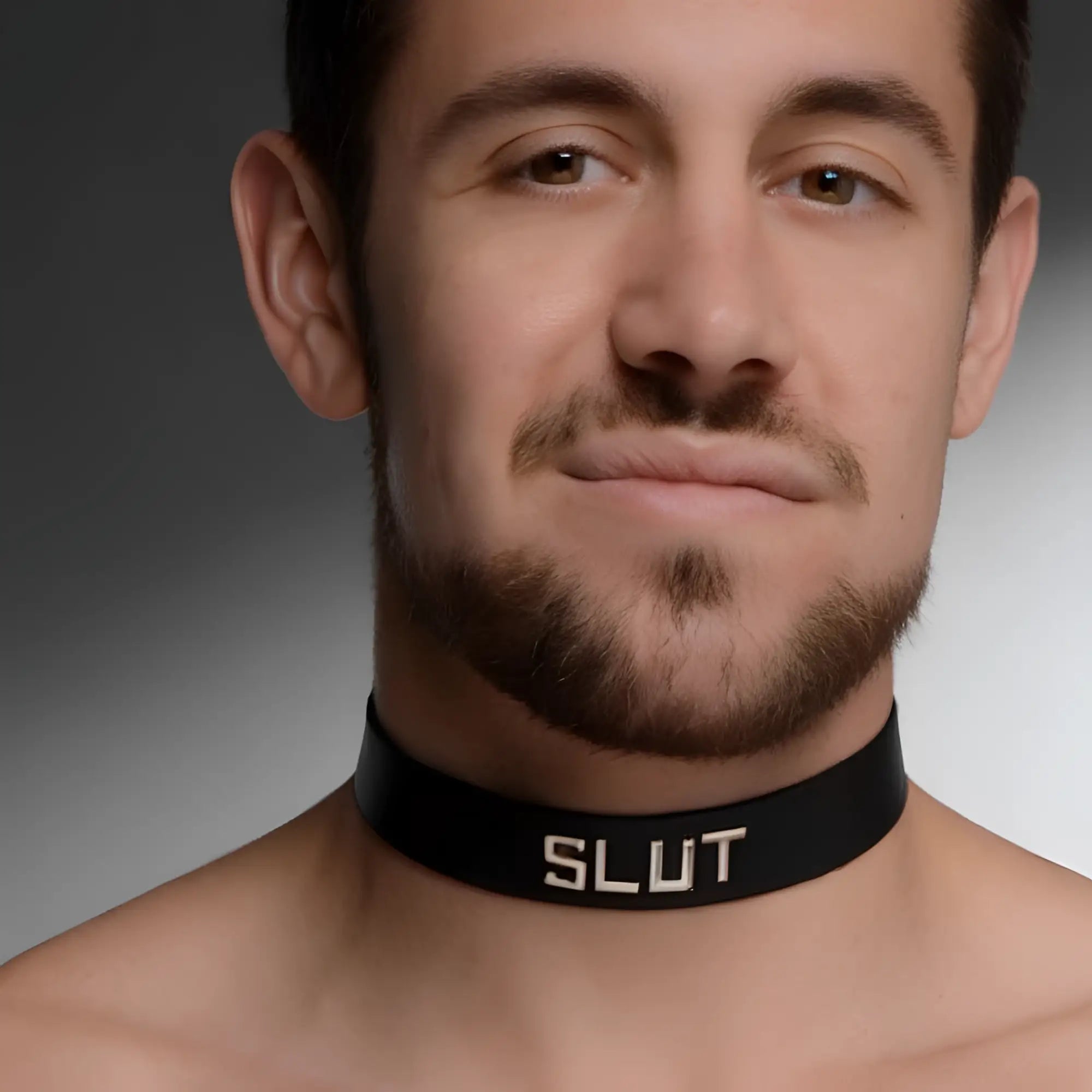Black leather identification collar with silver "SLUT" text on a man's neck.