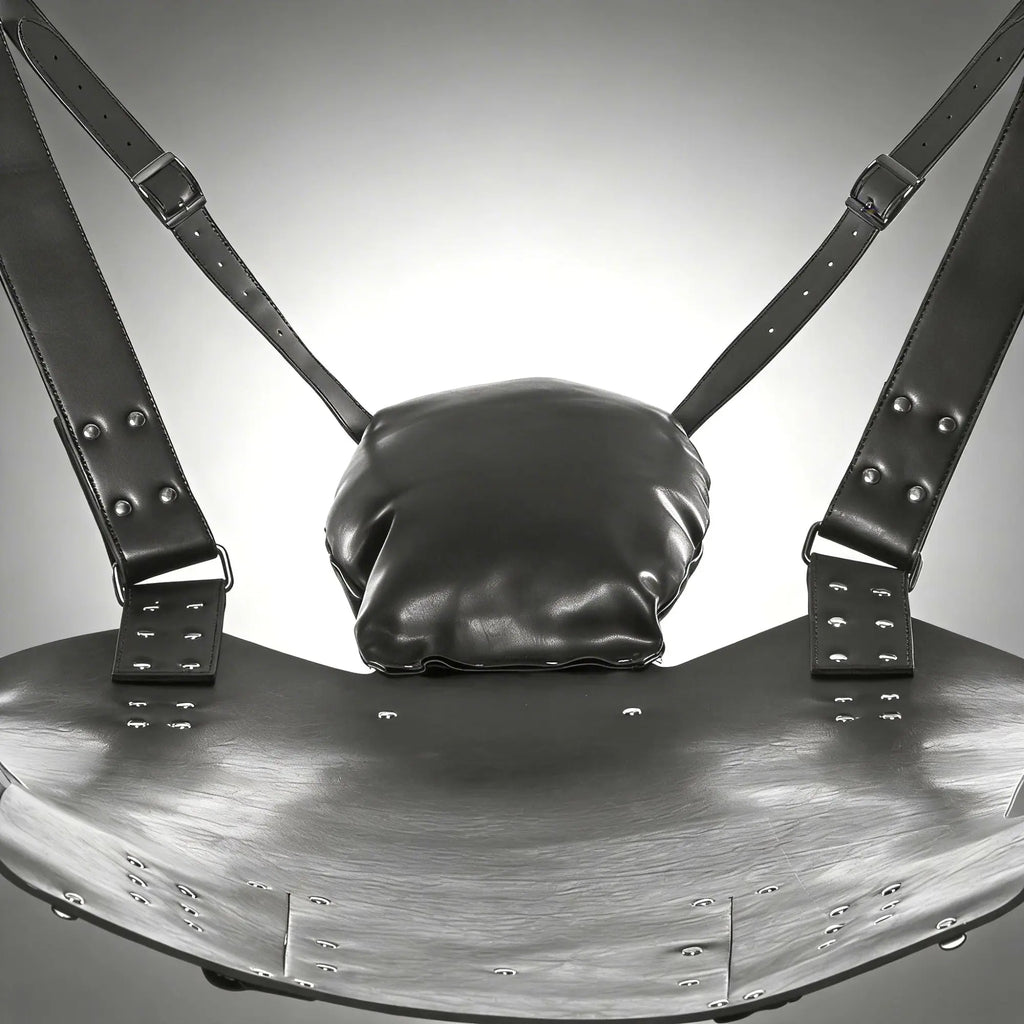Strict Leather Lined Sling with black leather seat, adjustable buckled straps, rivets, and a cushioned headrest pillow.