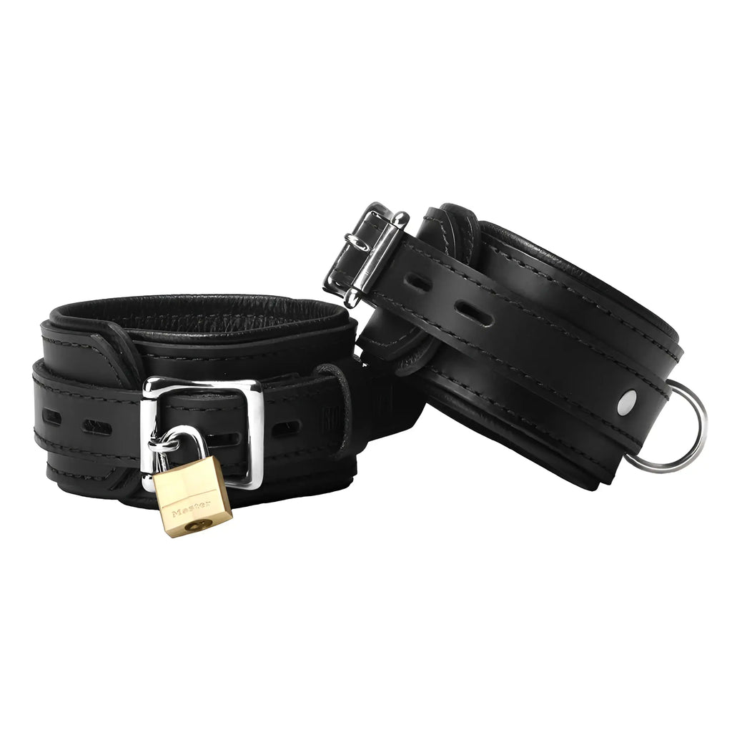 Strict Leather Premium Locking Cuffs: Two black leather cuffs with steel buckles, one secured by a brass padlock.