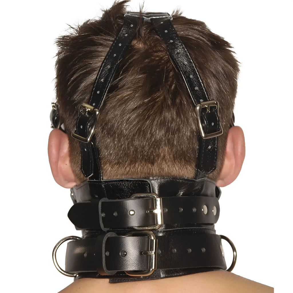 Strict Leather black premium leather muzzle, blindfold, and gag headpiece viewed from behind on a person.