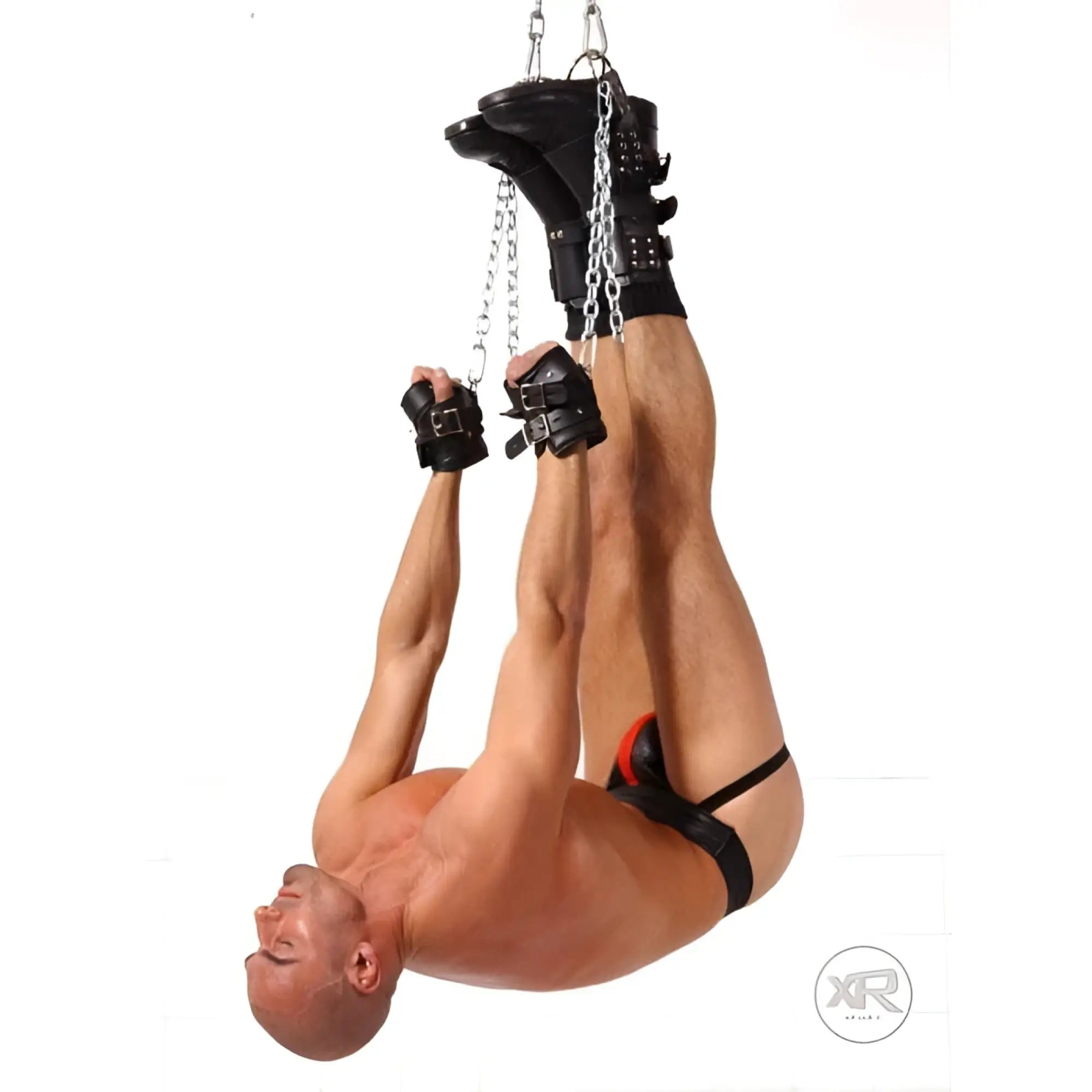 Strict Leather Premium Suspension Wrist Cuffs: black leather cuffs with steel chains suspending a person upside down.