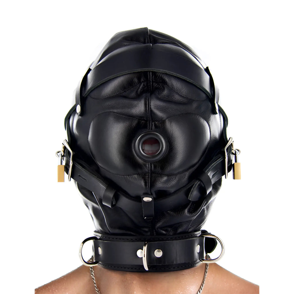 Strict Leather black leather sensory deprivation hood with padlocks, straps, and an open mouth piece on a person.