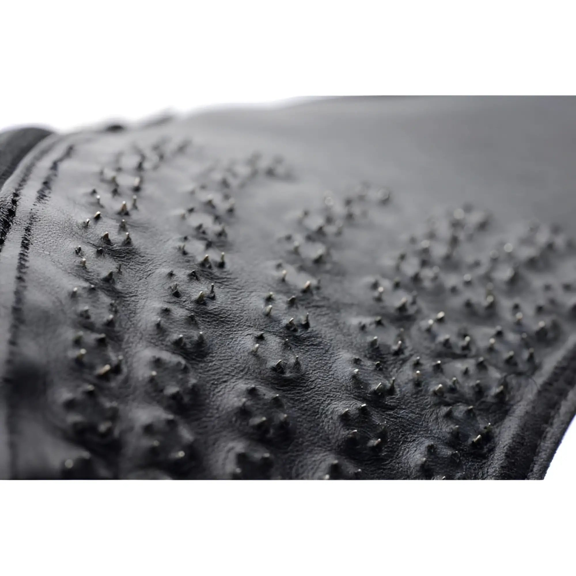 Close-up of a black Strict Leather Spiked Leather Confinement Jockstrap featuring rows of small metal spikes.