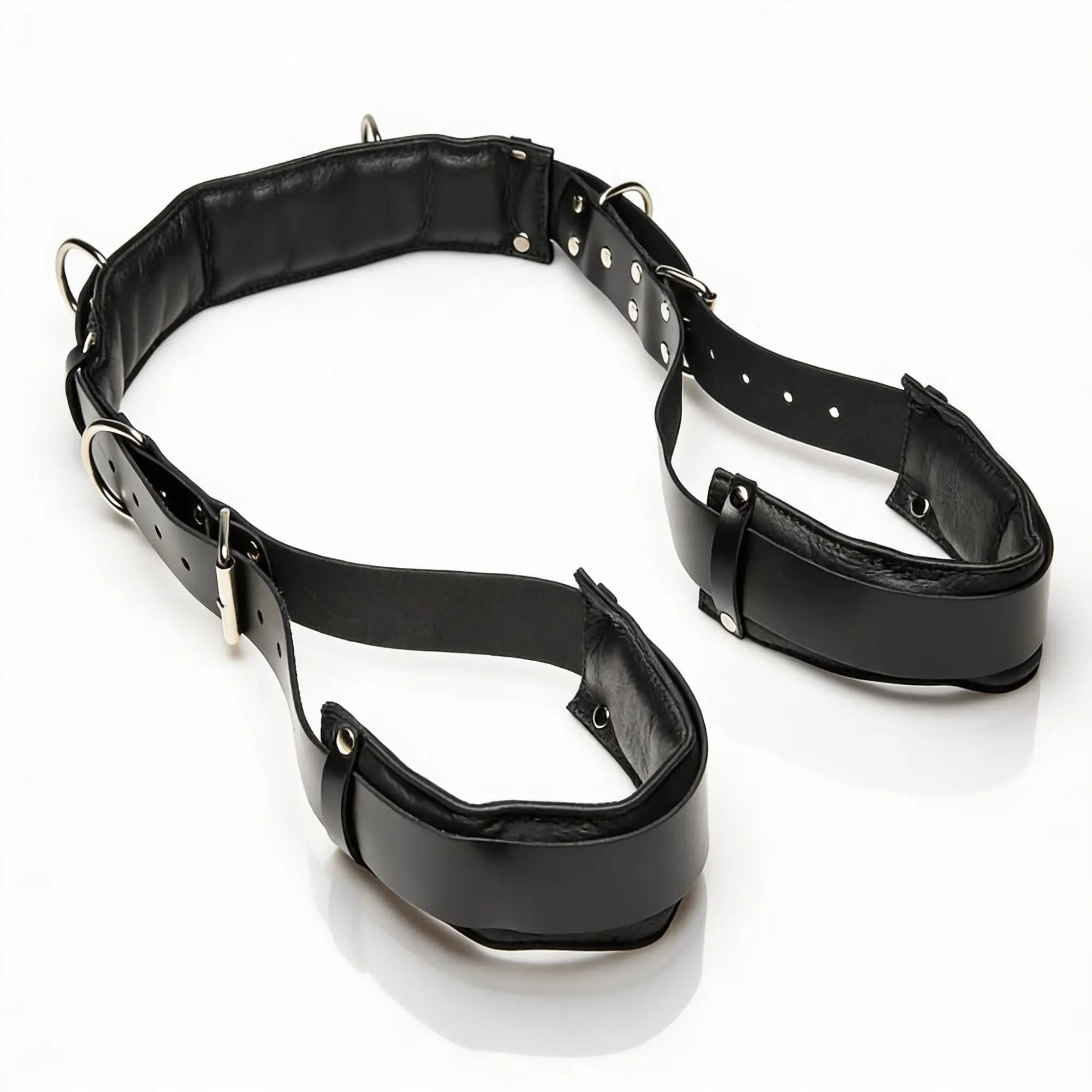 Strict Leather black leather thigh sling featuring padded cuffs, adjustable buckle straps, and silver-tone metal D-rings.