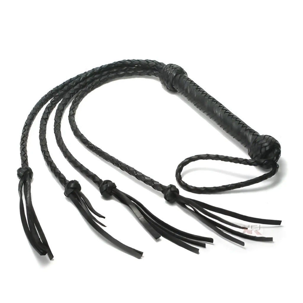 Strict Leather Tigress Whip: A black, braided leather multi-tail whip with a textured handle and knotted ends.