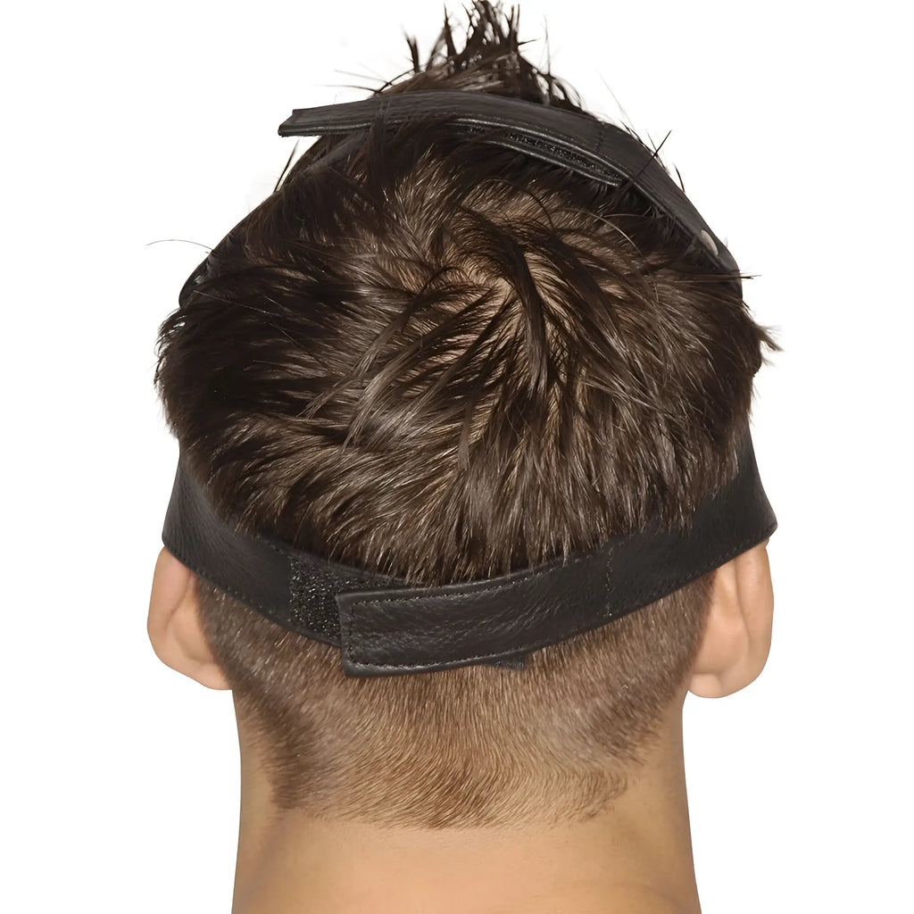 Back view of a person wearing a black, textured Strict Leather Upper Face Mask with an adjustable Velcro strap.