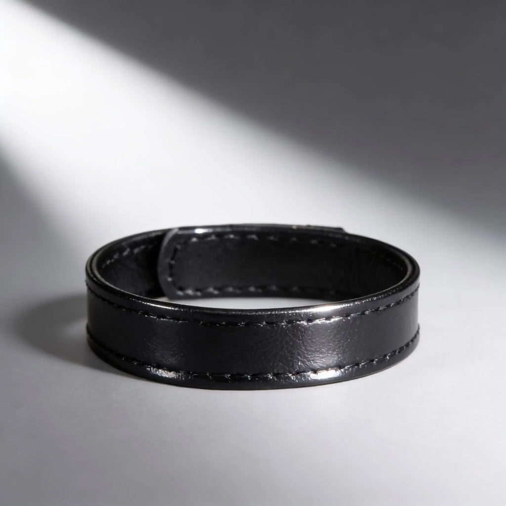 Black leather and velcro cock ring with stitched detailing.