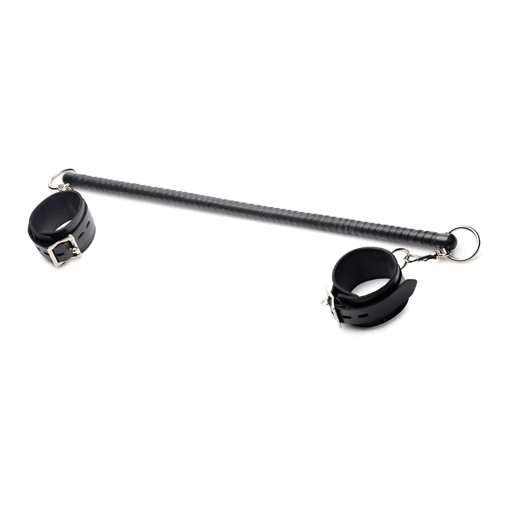 Strict Leather spreader bar: a long, black leather-wrapped rod with adjustable buckled cuffs at each end.