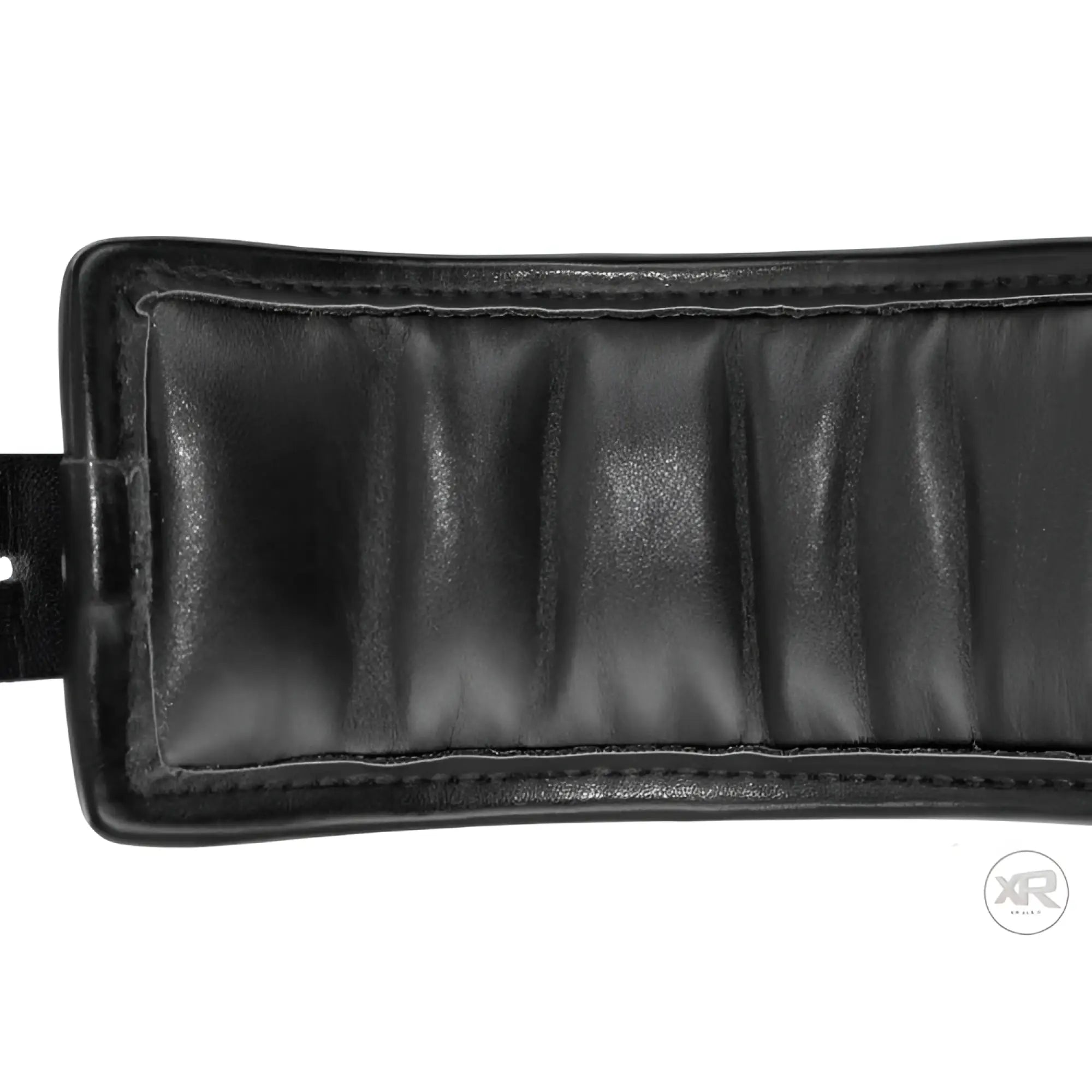 Close-up of a black, padded leather wrist cuff from the Strict Locking collection with detailed stitching.