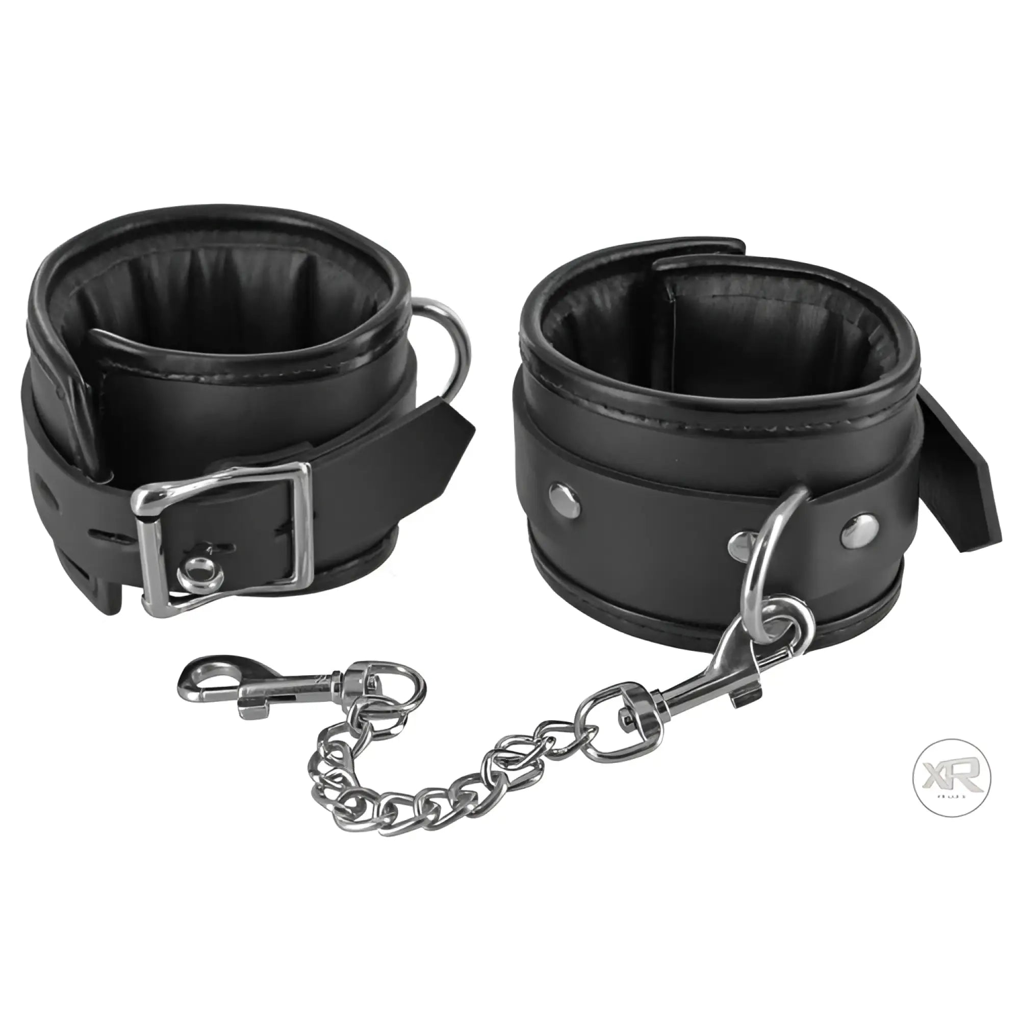 Strict Locking Padded Wrist Cuffs in black faux leather with silver-tone metal buckles and a detachable chain link.