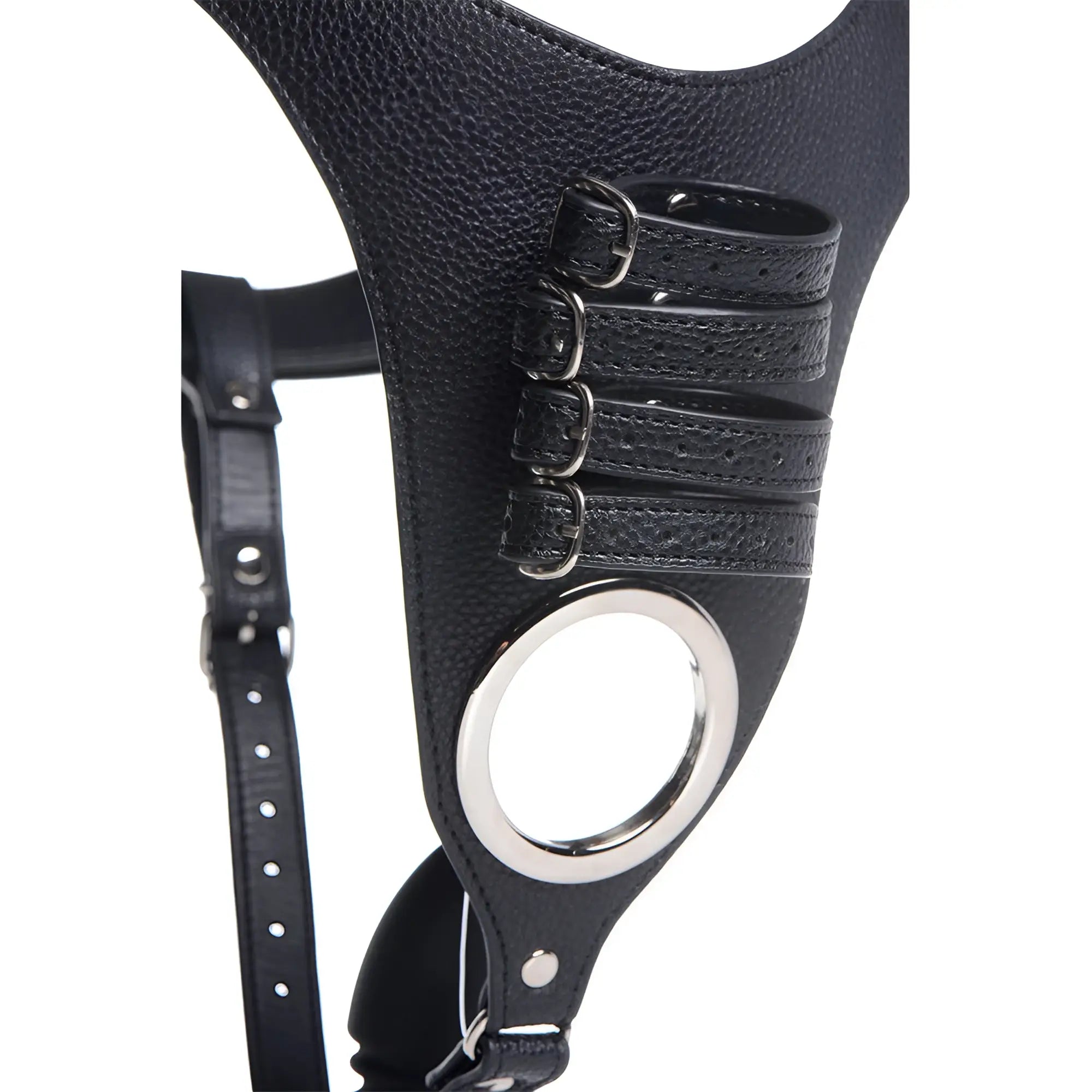 Strict male chastity harness in black faux leather with silver buckle straps and an integrated silicone anal plug.