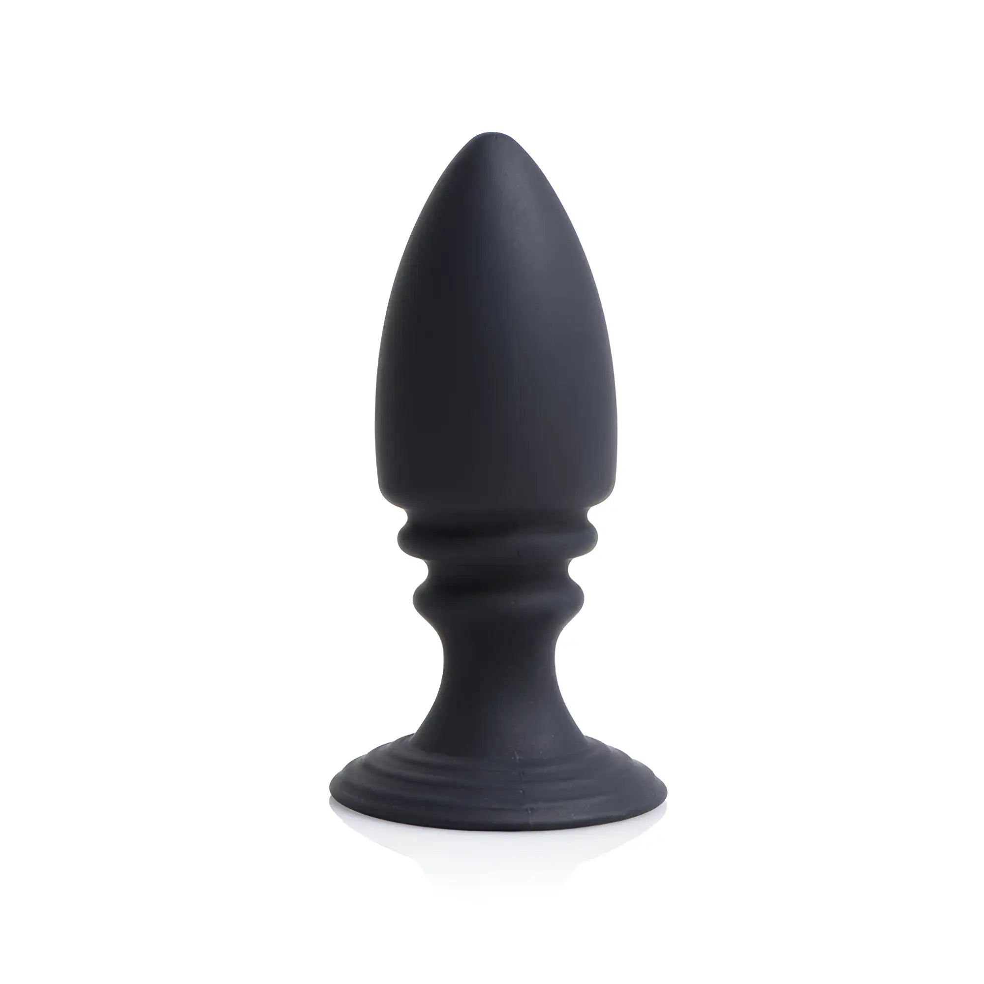 Strict Male Chastity Harness matte black silicone anal plug with a tapered tip and flared base against a white backdrop.