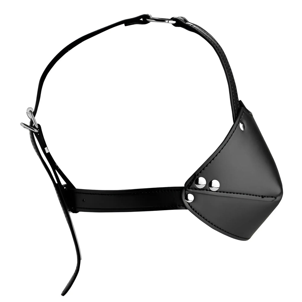 Strict Muzzle Harness with black leather straps and a cone-shaped muzzle featuring silver hardware accents.