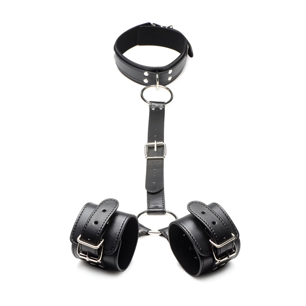 Strict Neck to Wrist Restraints: black faux leather collar and wrist cuffs connected by an adjustable buckled strap.