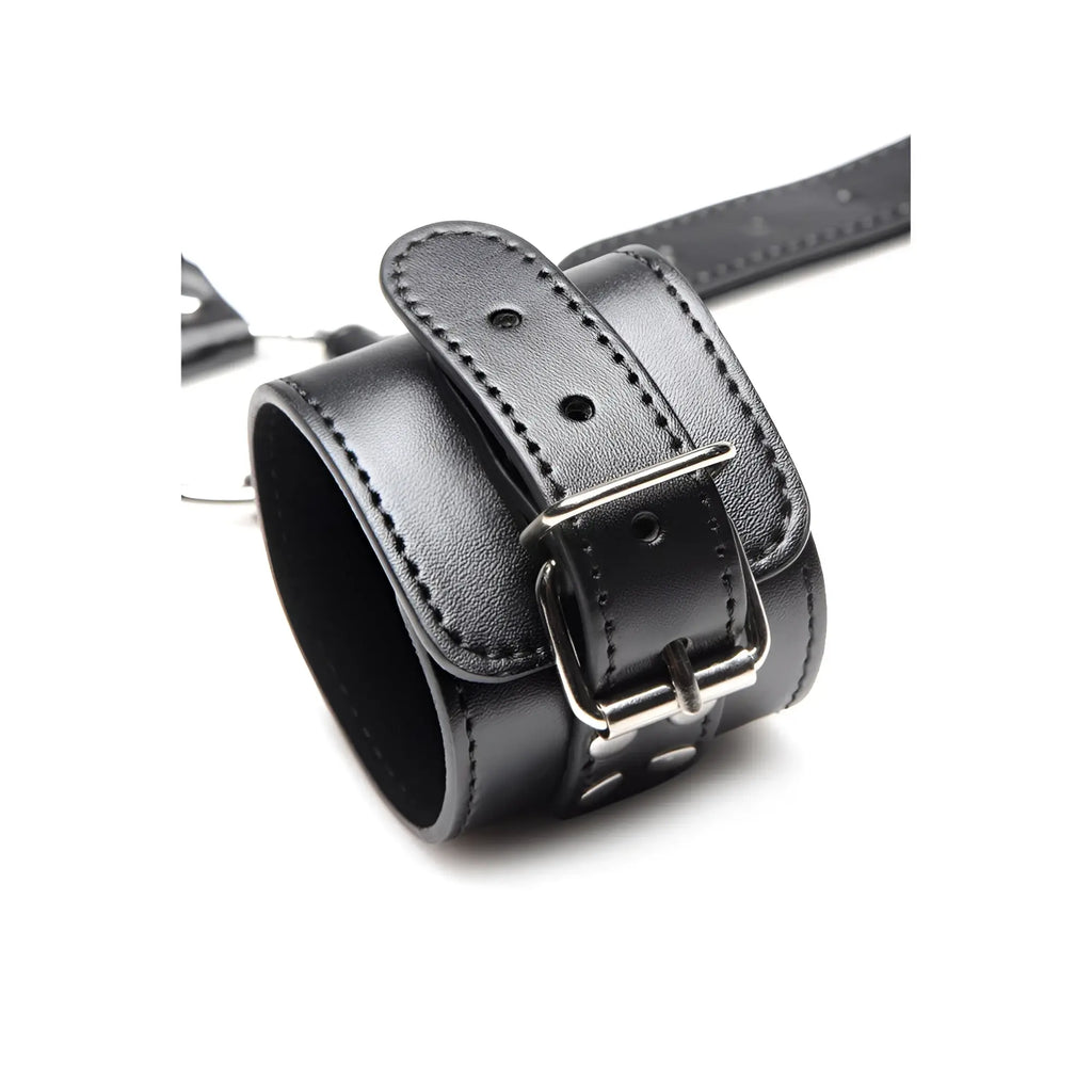 Strict Neck to Wrist Restraints: A black, padded leather cuff with a silver buckle and adjustable strap.