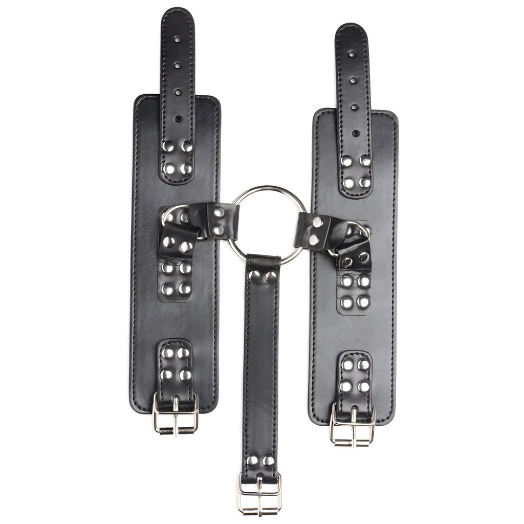Strict Neck to Wrist Restraints: Black leather cuffs and strap connected by a central silver metal ring with buckles.