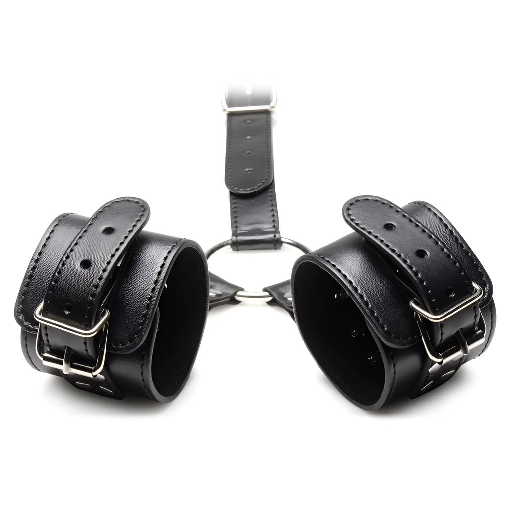 Strict Neck to Wrist Restraints: black faux leather cuffs with silver buckles connected by a central ring assembly.