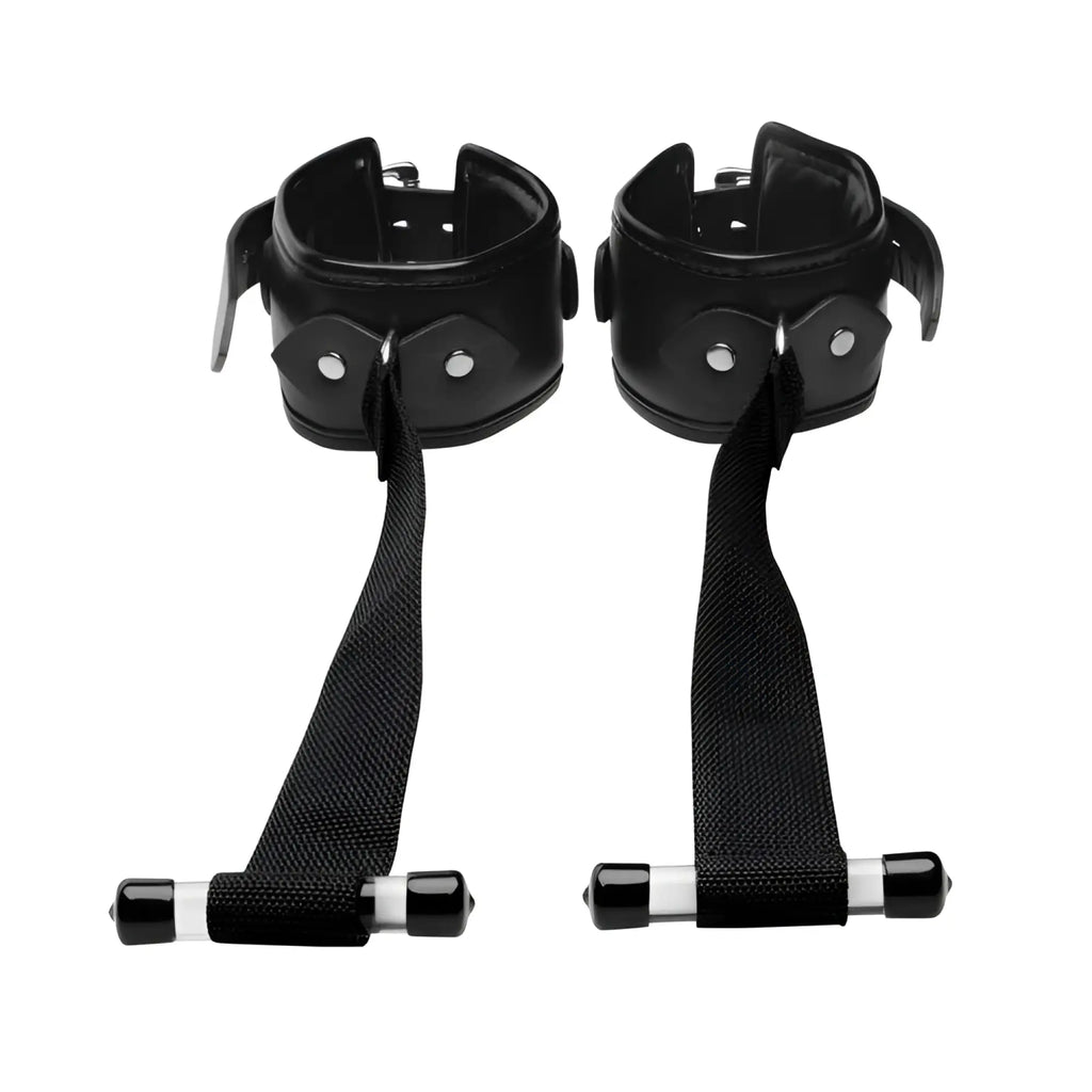 Strict Over the Door Restraint: A pair of black padded cuffs with nylon straps and T-shaped door anchors.