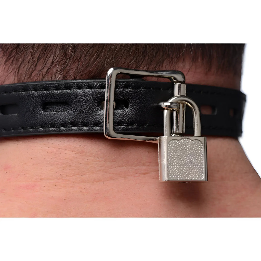 Strict Silicone Ball Gag with Nipple Clamps: Close-up of a black leather-style collar secured with a metal padlock.