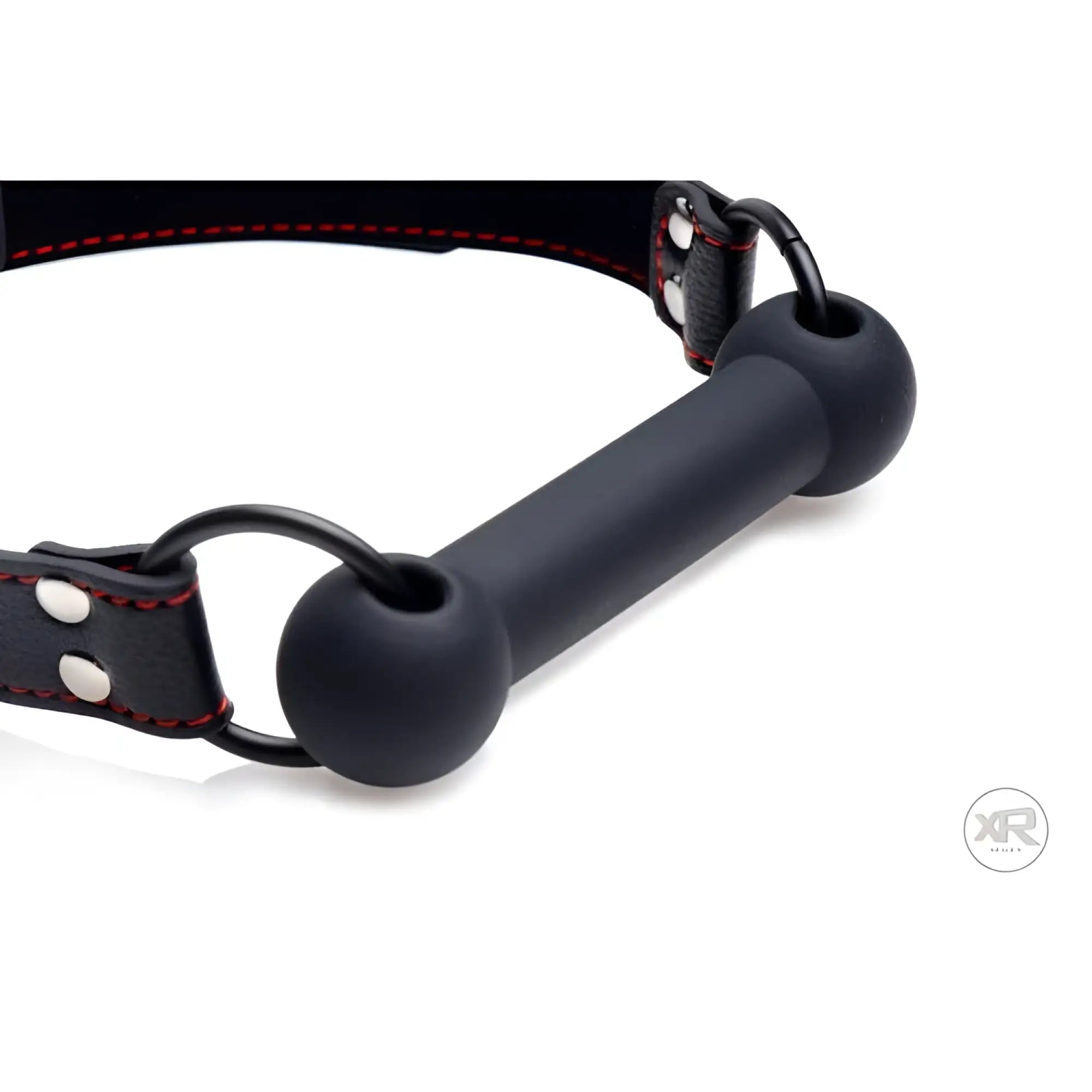 Strict Silicone Bit Gag: A black silicone bar bit with a matching black leather strap featuring red stitching.