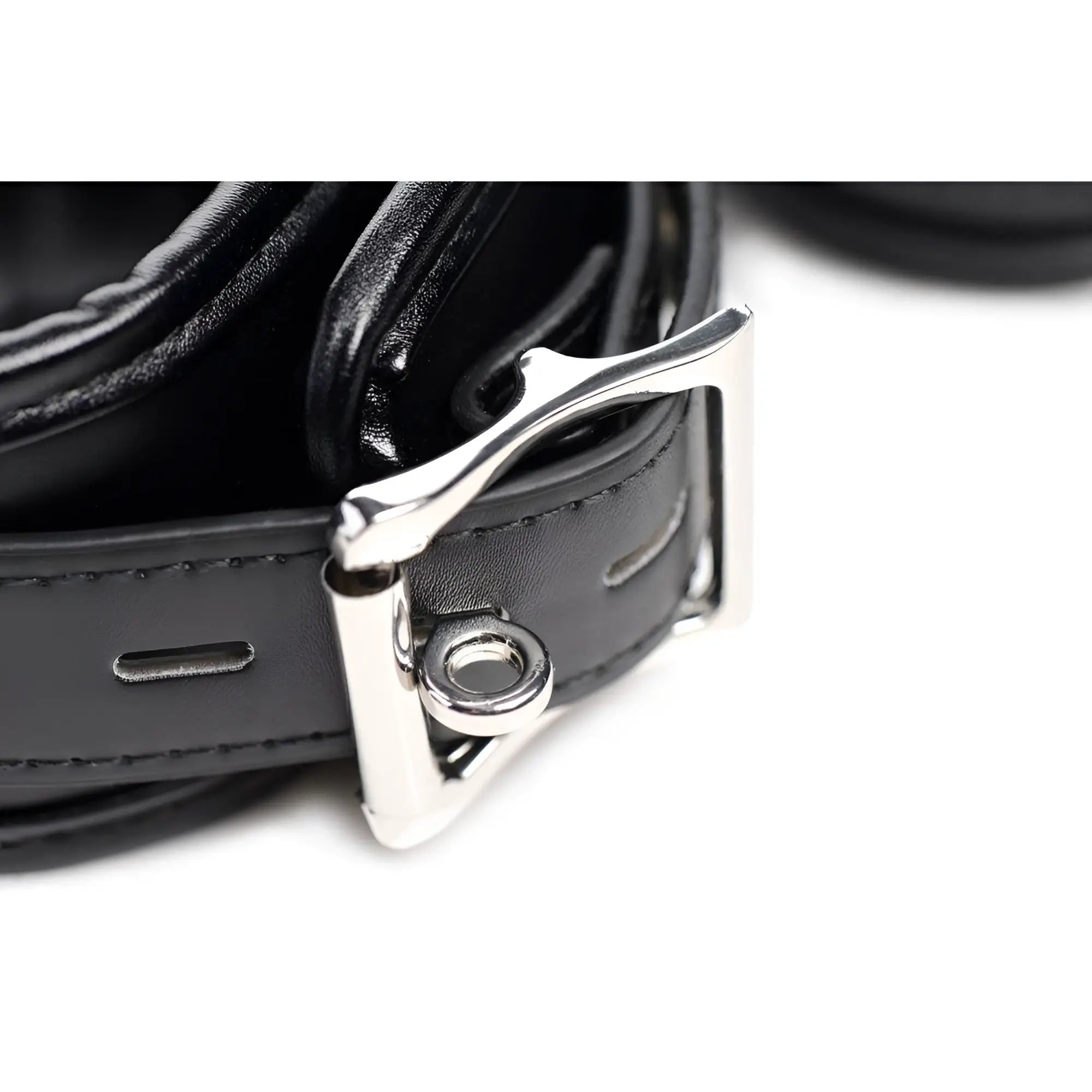 Strict Slave Bondage Shackle Set: Close-up of a black leather strap with silver-tone buckle and stitching.
