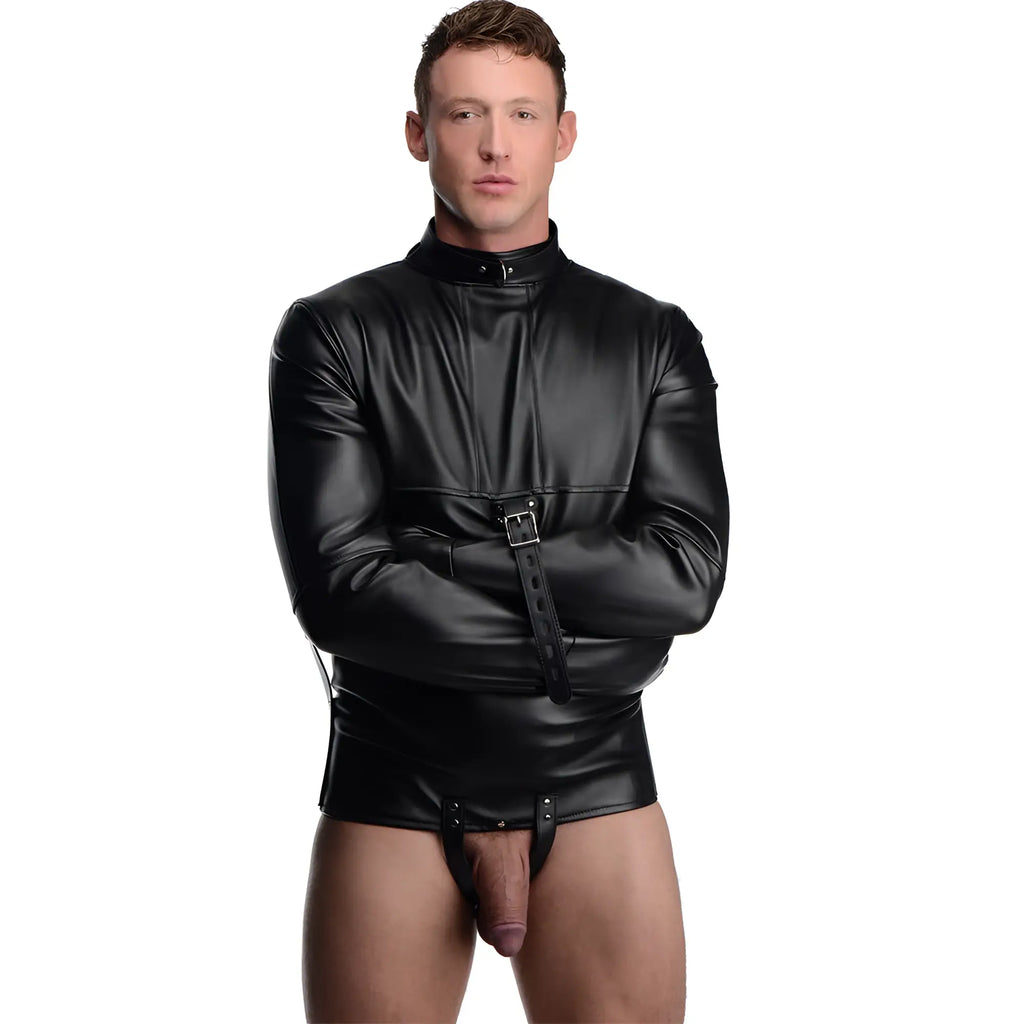 A man wearing a black faux-leather Strict Straight Jacket with buckled sleeves and a high collar.