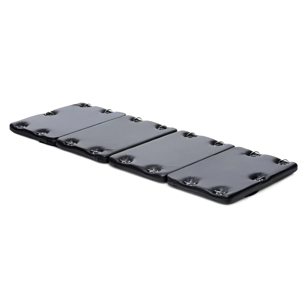 Strict XL Bondage Board: A rectangular, black, padded mat with integrated metal D-rings along the edges.