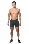 Black stripe stretch performance shorts with subtle textured pattern and elastic waistband for athletic use